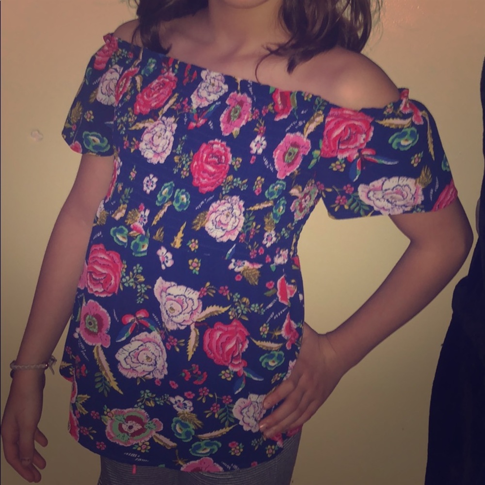 Off the shoulder flower print shirt.